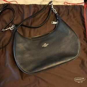 Coach black bag with straps, gently used great condition with original duster